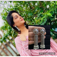 A striking pair of earrings inspired by ghungroos. Hoops with a bunch of playful ghungroos that add a fun element to the look. These Ghungroo Silver Oxidised Hoop Earrings spell elegant and effortless styling. Style this up with your favorite ethnics or pair them up with your casual outfits for a cheeky look!