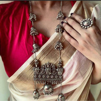 Indian dressing is incomplete without iconic jhumkis! Taking the same trend-forward, these dual tone Antique Silver earrings will justify your occasion-specific dressing as well as your simple kurtas! It features playful ghungaroos and tiny jhumkis at the bottom of the earrings that makes it an impactful piece of jewelry. These pair of earrings are lightweight and will add the right dose of drama to the look.