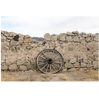 Wagon wheel against a stone fence at Hueco Tanks State Park, northwest of El Paso, TX-Paper Art-38"x26"