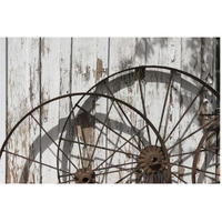 Old wagon wheels against a shed in Buffalo Gap Historic Village, near Abilene, TX-Paper Art-62"x42"