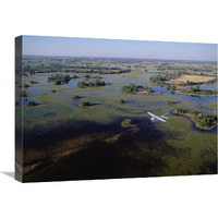 Safari airplane flying over the flooded Okavango Delta, Botswana-Canvas Art-24"x18"