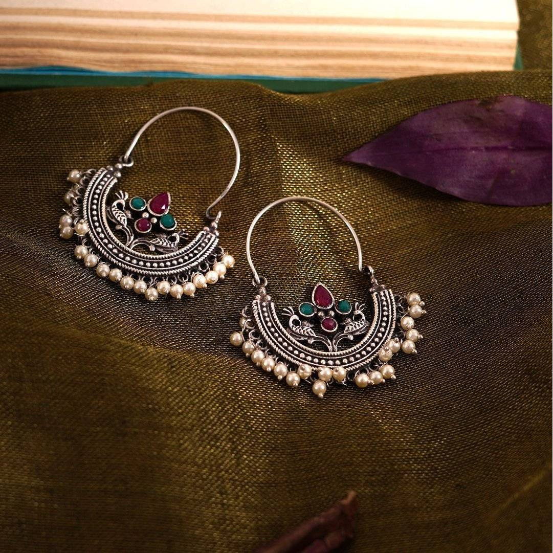 This stunning set with its one of a kind pieces is extremely versatile, a styling delight and truly exotic. Taking notes from the tribal moods of India, the jewellery is crafted in german silver with oxidised silver finish for a classic appeal. Wear them separately or all together , this gift set is a stylist's delight.