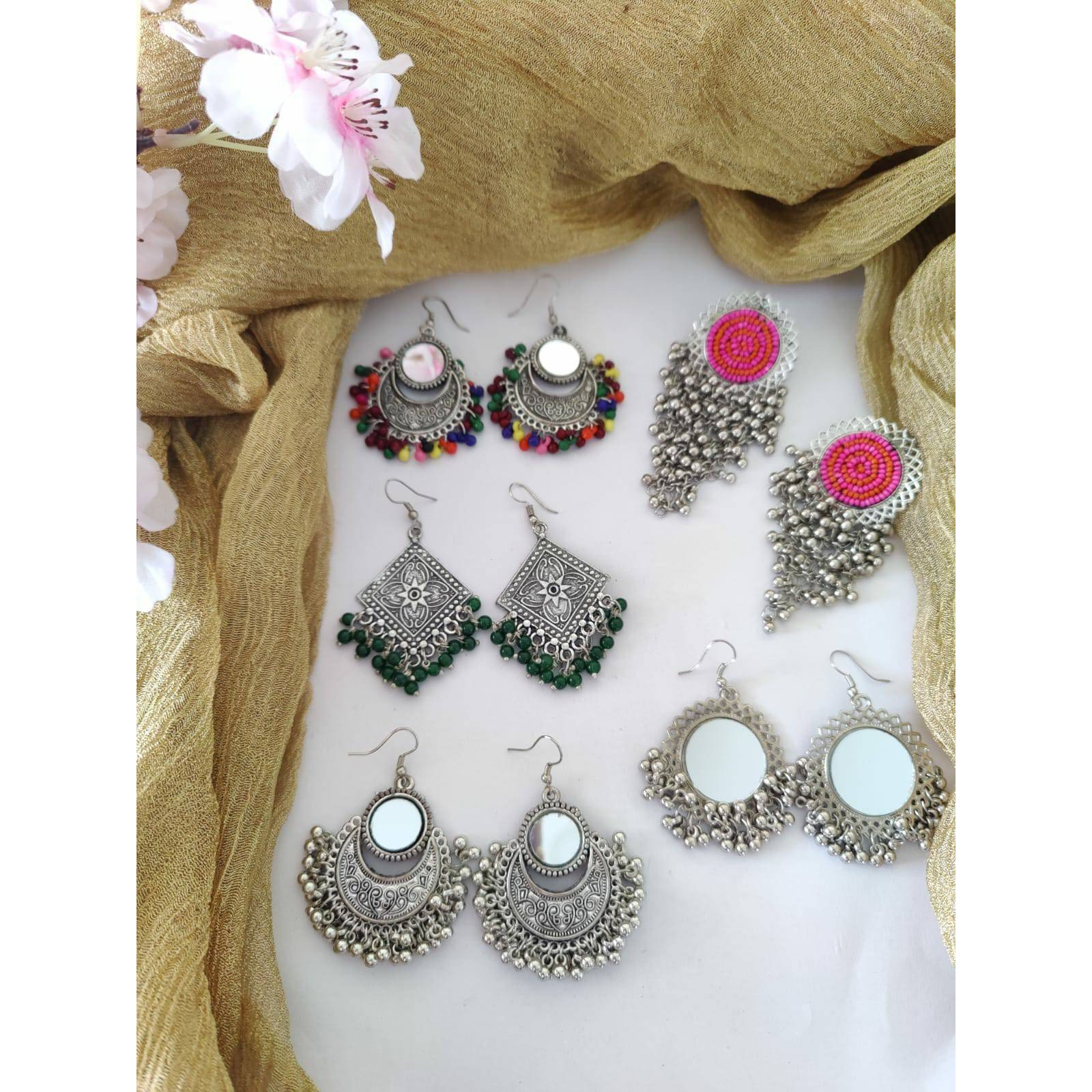 Celebrate your Navratri with this double necklace ful combo set.This beautiful set of 5 has a big long Haram oxidized necklace, pair of jhumka earrings, a ring,pair of bangles, and a nose pin.Grab this beautiful set with any of the ethnic/ Indo western outfit and look unique in the crowd.Premium quality!!
