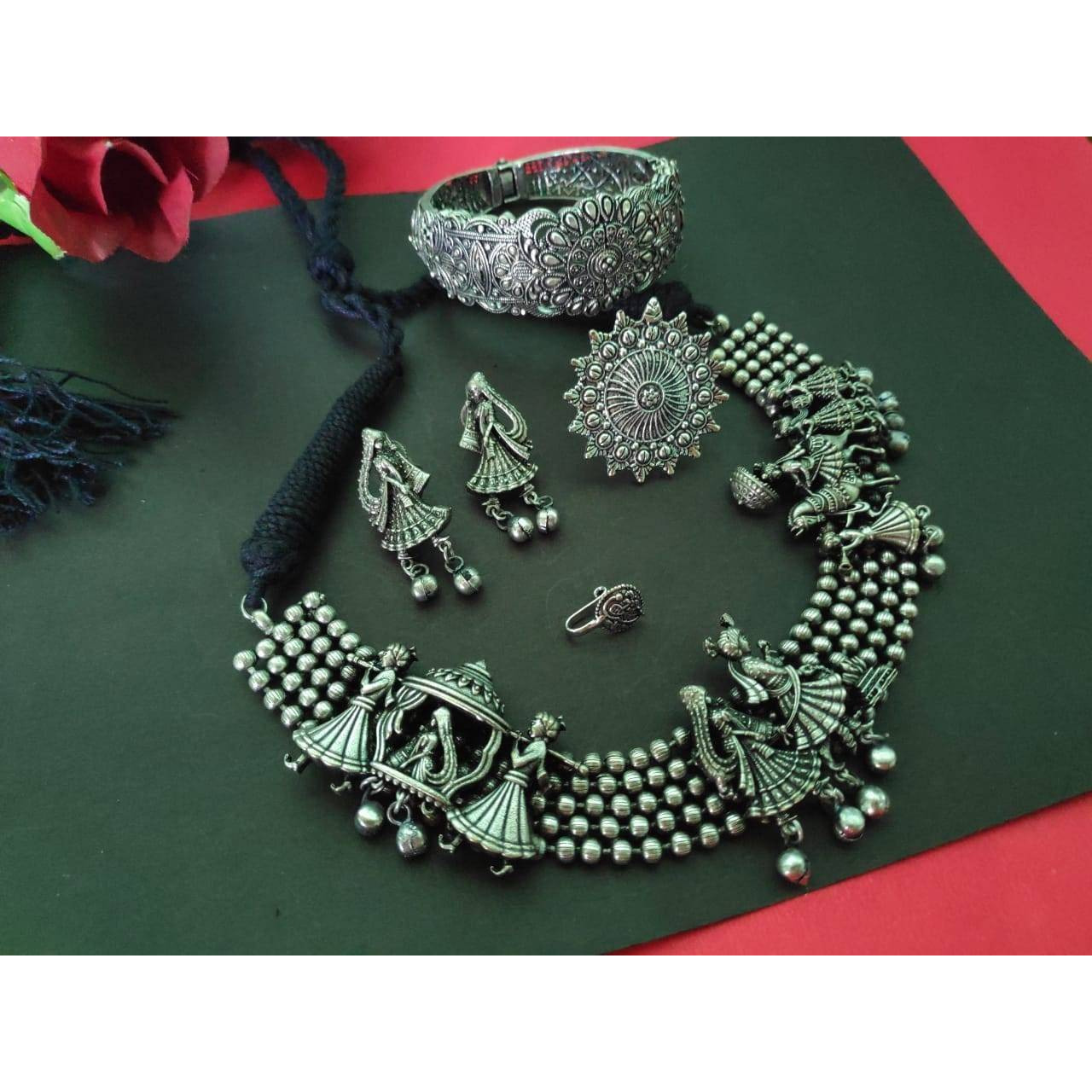 If you like to flaunt Indian jewelry, it is time to order the magnificent pair of silver kada. The oxidizedjewelry is a wonderful example of fine craftsmanship and is handmade with a lot of care andprecision. Made with brass, the mid-century style kada can be paired with Indian traditional dressesas well as casual wear. The kada has a latch and can be easily opened and closed, making it perfectfor everyday wear. Add a touch of elegance to your jewelry collection with these fascinating oxidisedba