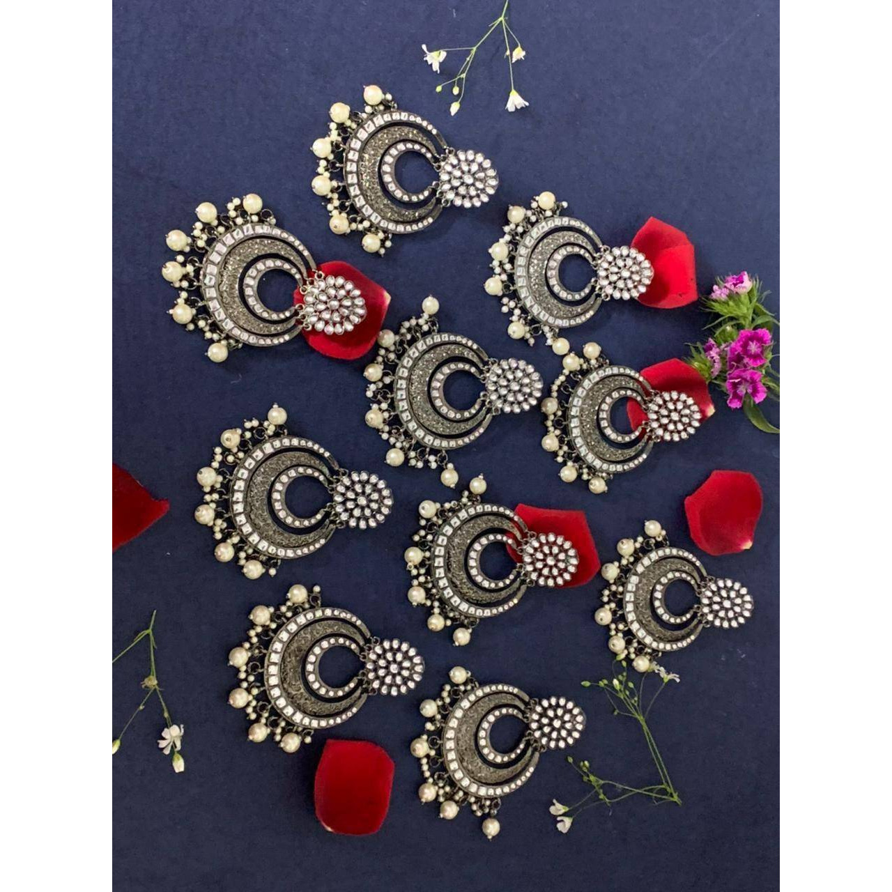 Step out in style with this beautiful oxidised silver plated earrings, which have been given a drop designer dangler perfectly designed. It will add bling to your look. This earring will go well with any of your ethnic outfits.