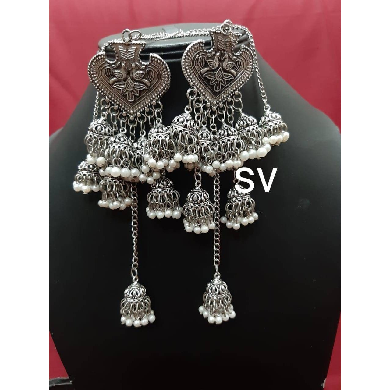 Add ethnicity and elegance to your beautiful personality with these exquisitely designed handmade earrings with pearls drop. The intricate designs gives these earrings a very classy touch. Wear them with any semi formal or casual attire and gather compliments all the way!