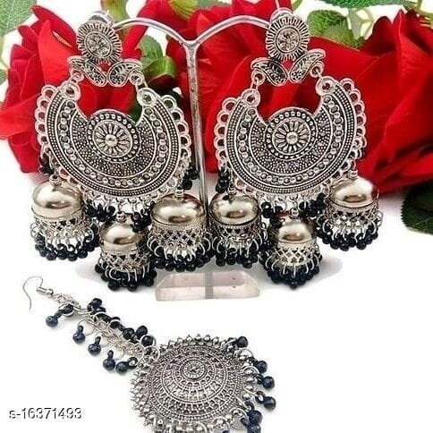 Jazz up your ethnic look with these gungroo earrings. This Ghungroo Silver Oxidised Earrings are handcrafted with oxidized silver and feature an iconic bunch of playful ghungroos that add a lively character to your look. With ghungroos always being a trendsetter, these earrings will surely be a favorite