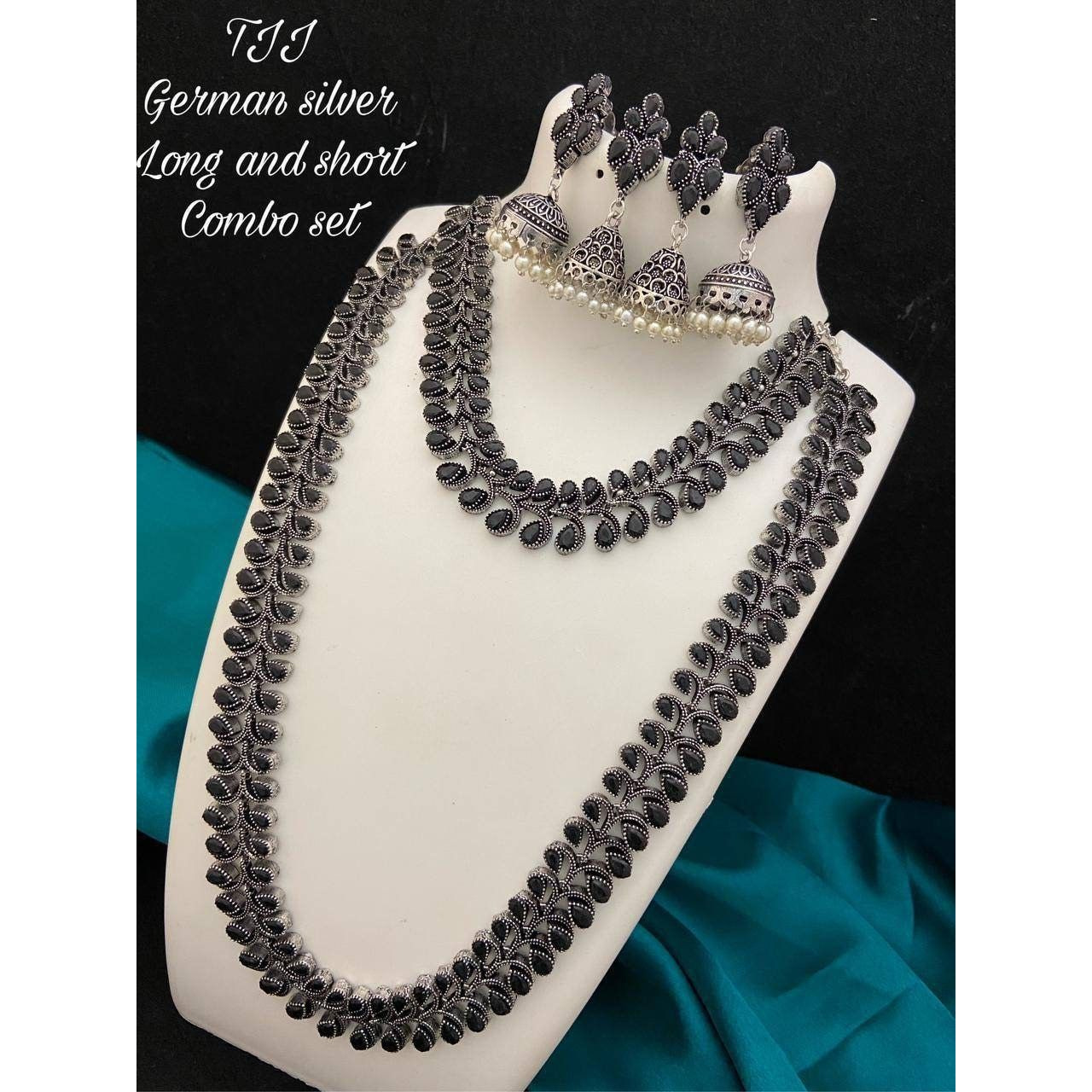 Are you looking to step up your ethnic look by a notch? This oxidized silver jewelry is the perfect product for you. This set consists of an oxidized choker and a pair of jhumkas. The beautifully designed traditional jhumkas, paired with a touch of contemporary style on the choker, make this the bestseller combo. This set is a perfect fit for????wedding jewelry????and party wear. You can flaunt this set with an elegant saree or a gorgeous lehenga to make the jewelry shine. The????Kundan earrings