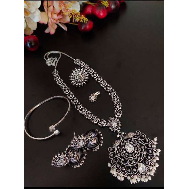 Dramatising the classic hoop style of earrings, is this gorgeous pair of earrings that boasts of striking detail with ghungroo hangings.. Glamorous yet effortless, these hoops are real keepers for souls who are looking for a classic yet versatile piece of jewelry. The kind of jewelry that adds oomph to your casual wear and also matches the edge of your occasion special Indian Wear.