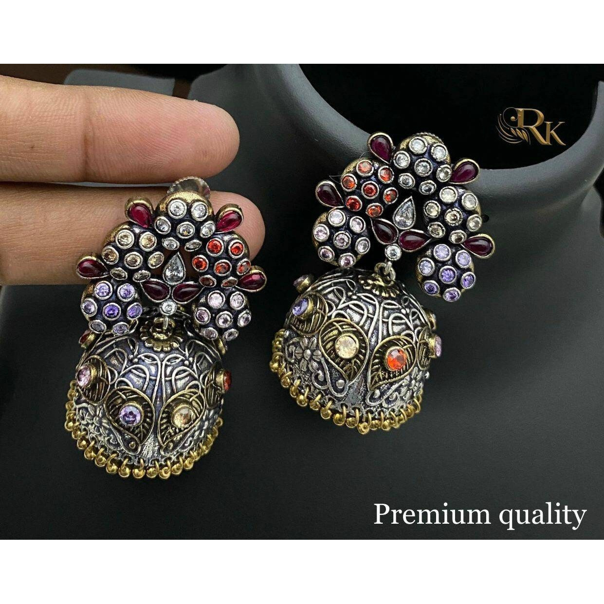 Silver oxidised earrings are an obsession for us and we fuel the obsession with a big bold version of the same recreated in these lovely earrings. Jhumkis remains an integral part of Indian dressing and will be adorned forever. This Antique Silver Jhumki Earrings will be a perfect accessory to complete your ethnic look this season. The beauty of this accessory lies in the intricate circular motifs. This pair of earrings will justify your white shirt and that Kurta and denim casual look.