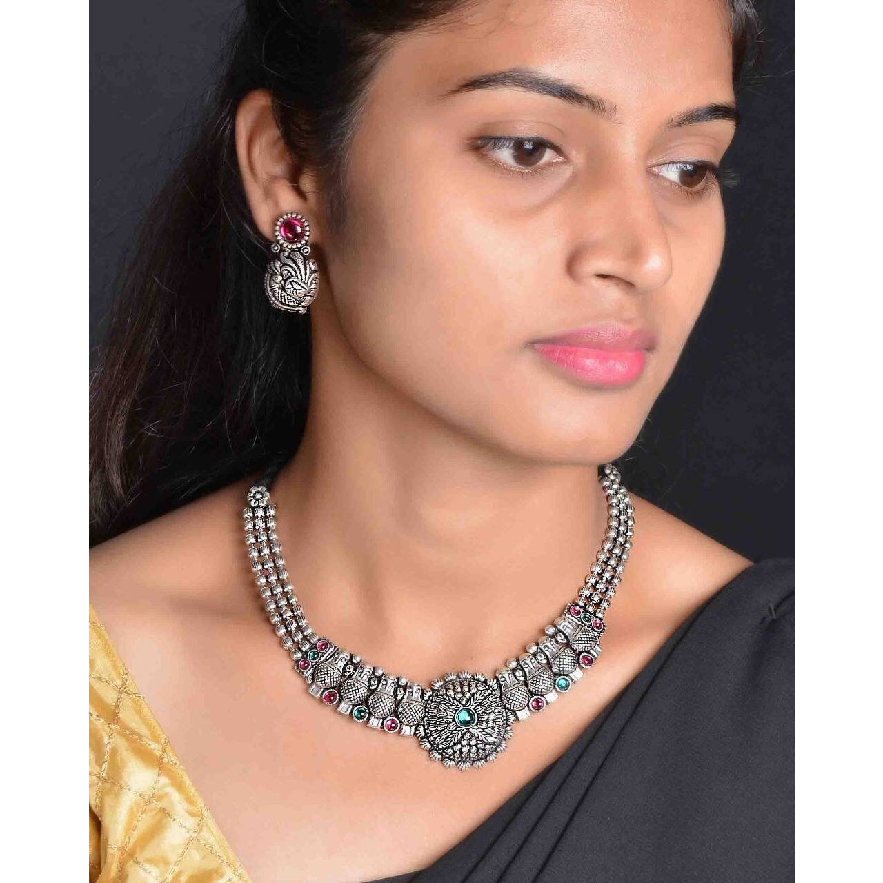 Adorn your beautiful personality with this exquisitely designed and handcrafted necklace ( set of 5) in high quality German Silver. Pair it up with any casual,semi formal or formal attire for that traditional yet contemporary look.This beautiful jewellery set includes Ghungroo choker, pair of earrings, bracelet, nosepin and a ring.Amazing quality