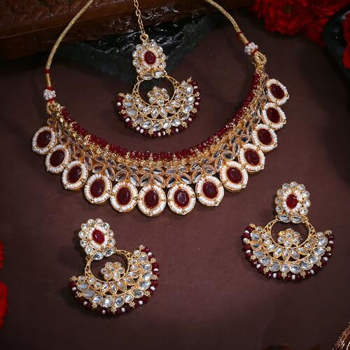 Gehena by Estele Gold Plated Resplendent Designer Ruby Studded Crystals with Cluster Beaded Choker Necklace Set and Maang Tikka for Girls and Women