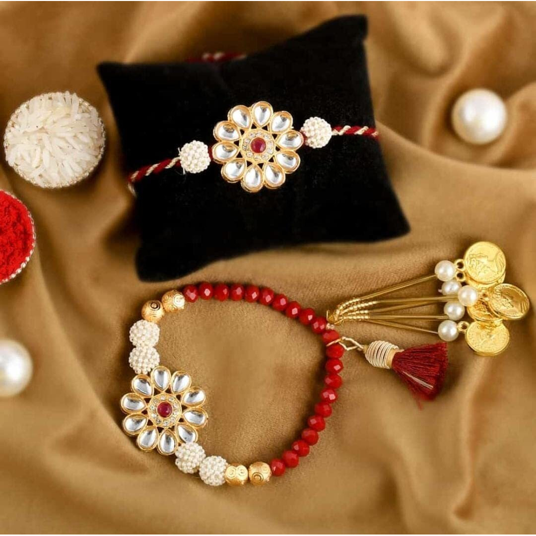 Kalakriti Rakhi for Brother and Bhabhi Combo Set of 2 With Designer Kundan Lumba Bracelet for Bhabhi With Roli Chawal, Raksha Bandhan Greeting Card and Printed Potli Bag (Rakhi 1)