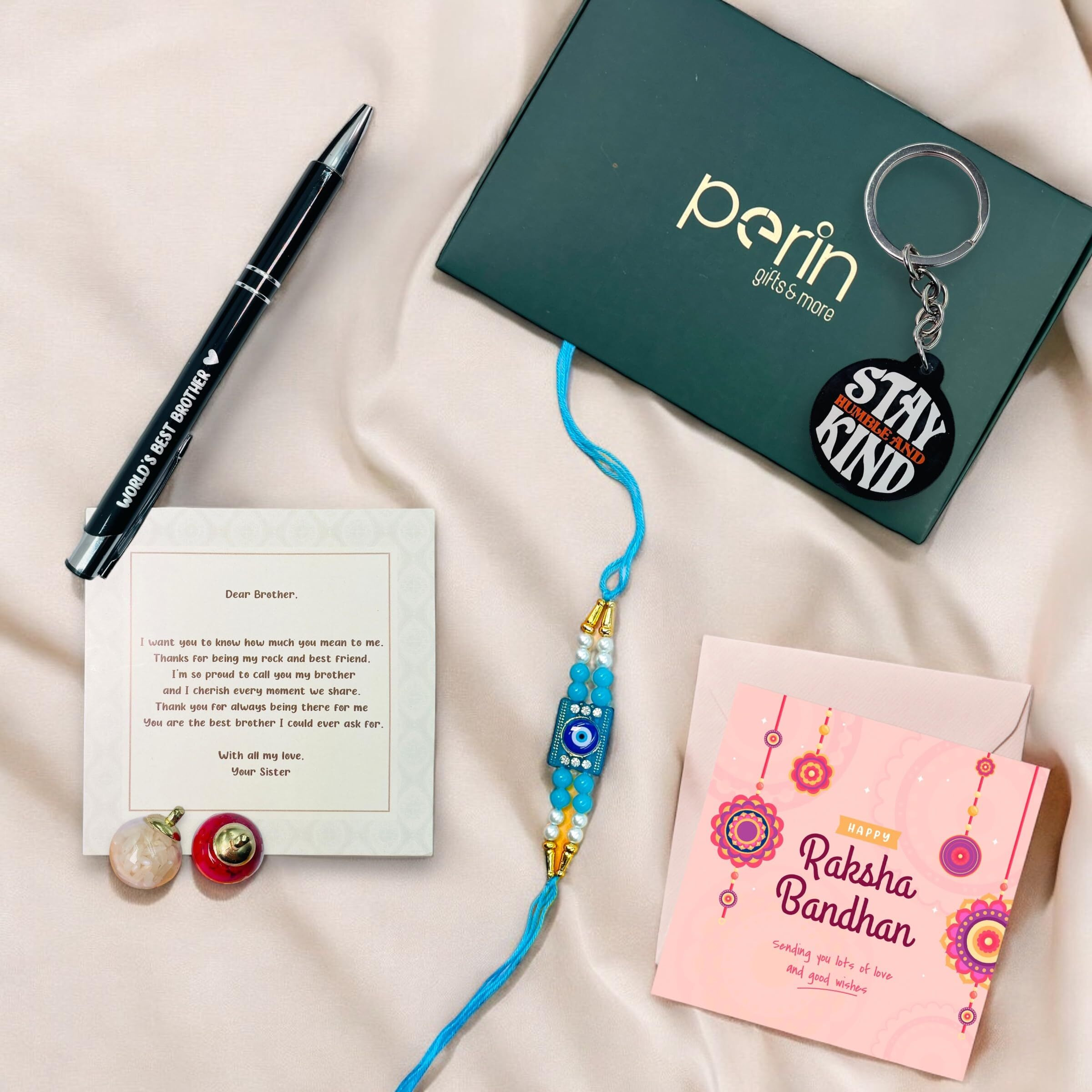 SINCE 7 STORE Rakhi Gift Hamper for Brother - Includes 6 Products Metal Pen which says Worlds Best Brother, Keychain, Rakhi, Set of Roli, Greeting Card & Heartfelt Note from Sister